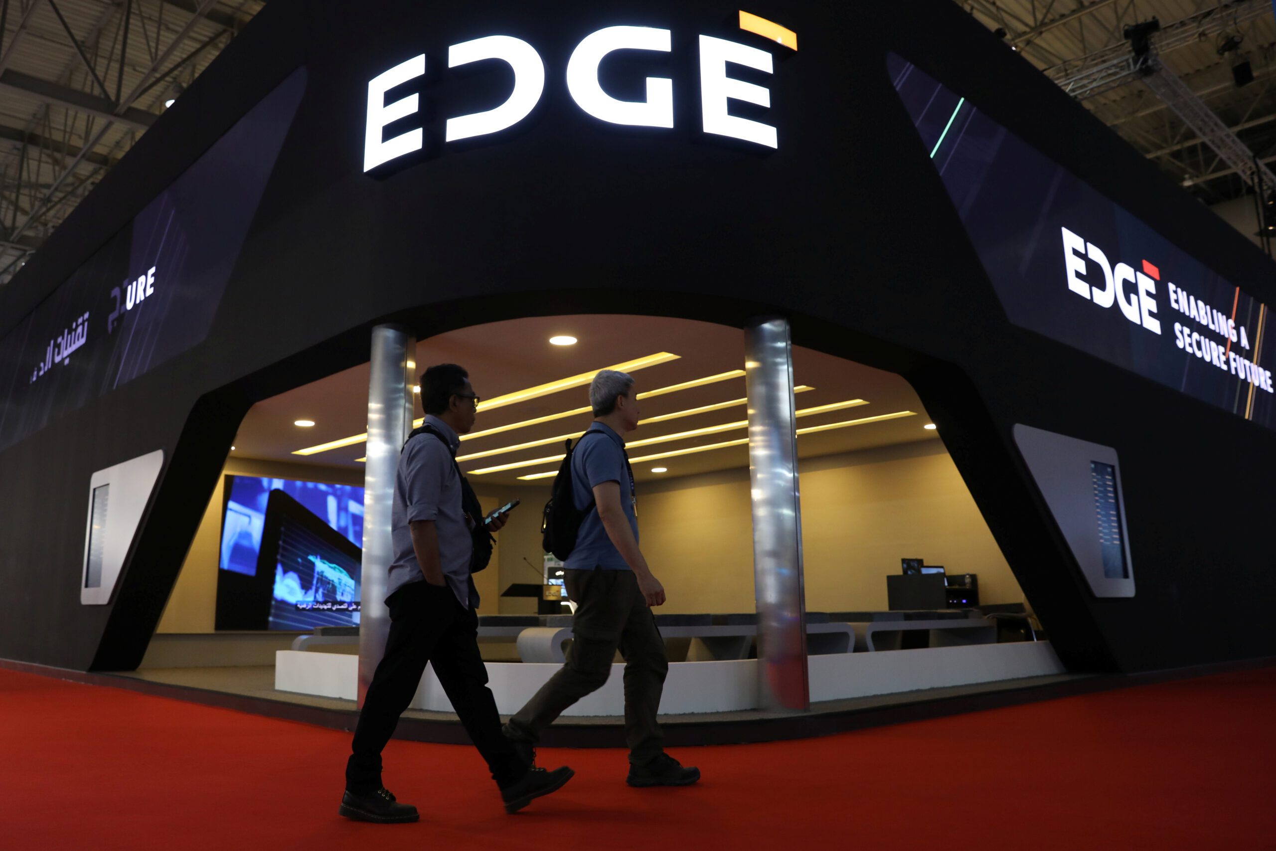 Visitors walk past the EDGE Group display during Dubai Air Show in Dubai, United Arab Emirates, November 21, 2019. (REUTERS/Christopher Pike)