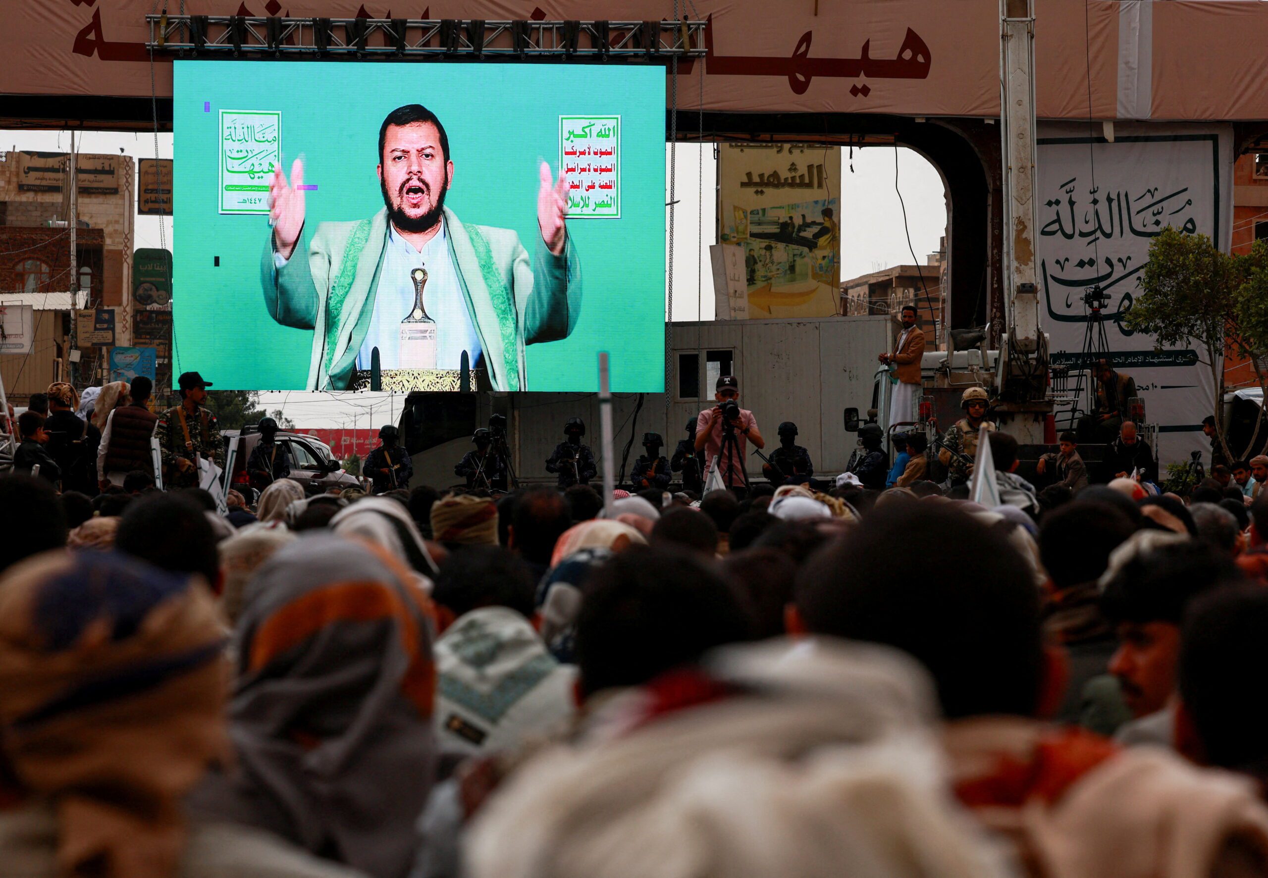 Supporters of Yemen's Houthi movement watch a speech by the movement's leader, Abdul Malik al-Houthi, displayed on a big screen in Sanaa, Yemen, July 6. (REUTERS/Khaled Abdullah)