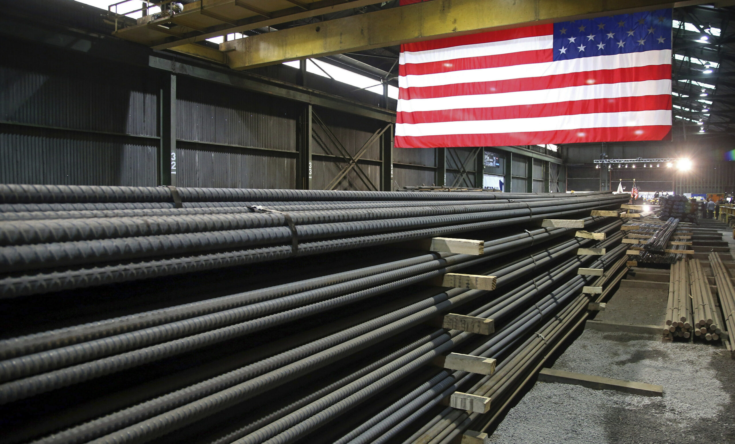 Steel rods produced at the Gerdau Ameristeel mill in St. Paul, Minnesota await shipment, May 9, 2019. (AP Photo/Jim Mone, File)