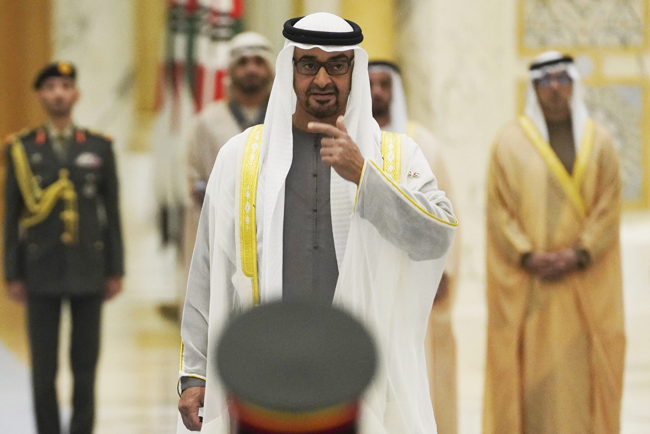 Emirati President Mohammed bin Zayed al-Nahyan gestures toward an honor guard at Qasar Al Watan in Abu Dhabi, United Arab Emirates, on Jan. 15. (AP Photo/Jon Gambrell, File)