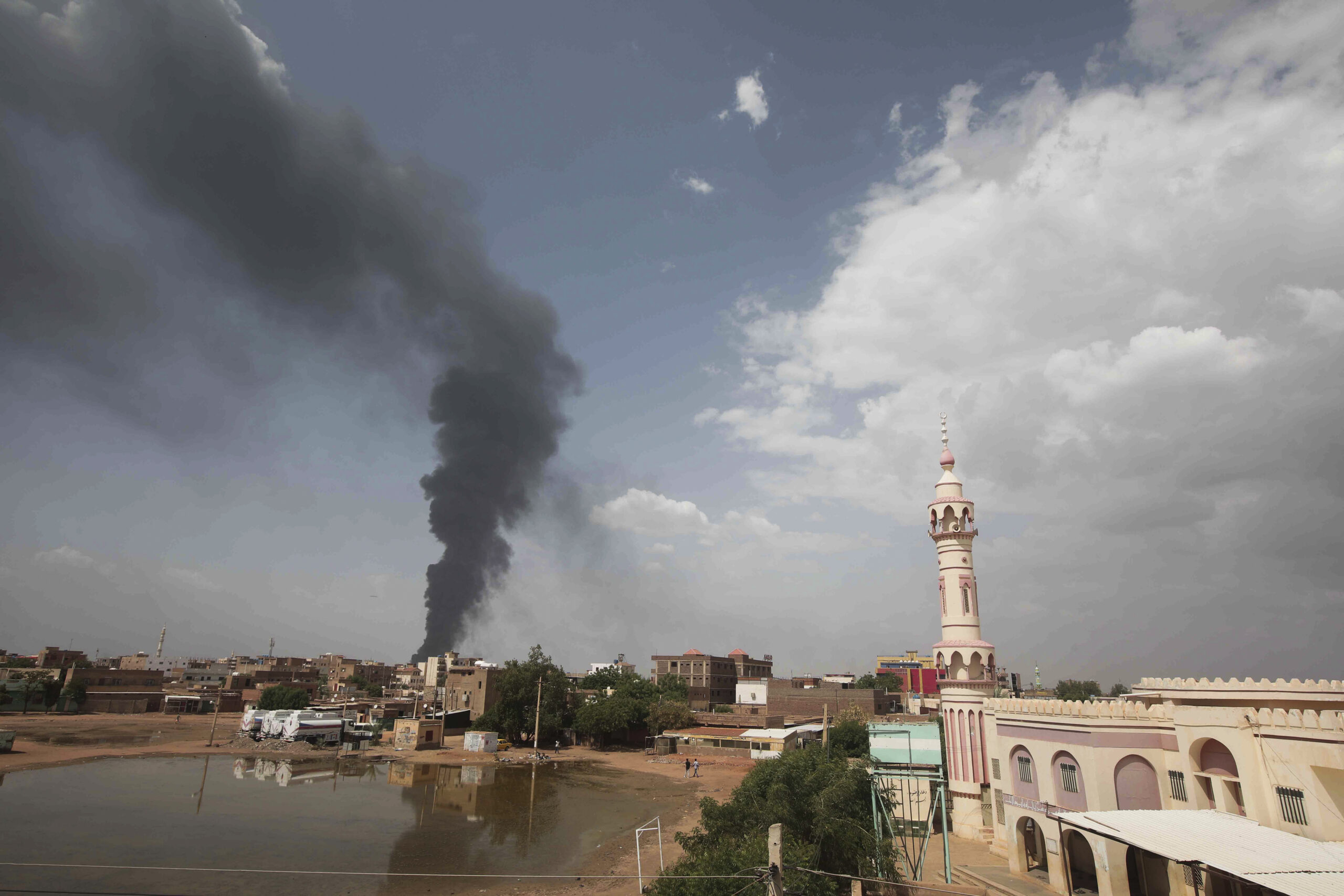 Smoke rises over Khartoum, Sudan, June 8. (AP Photo)