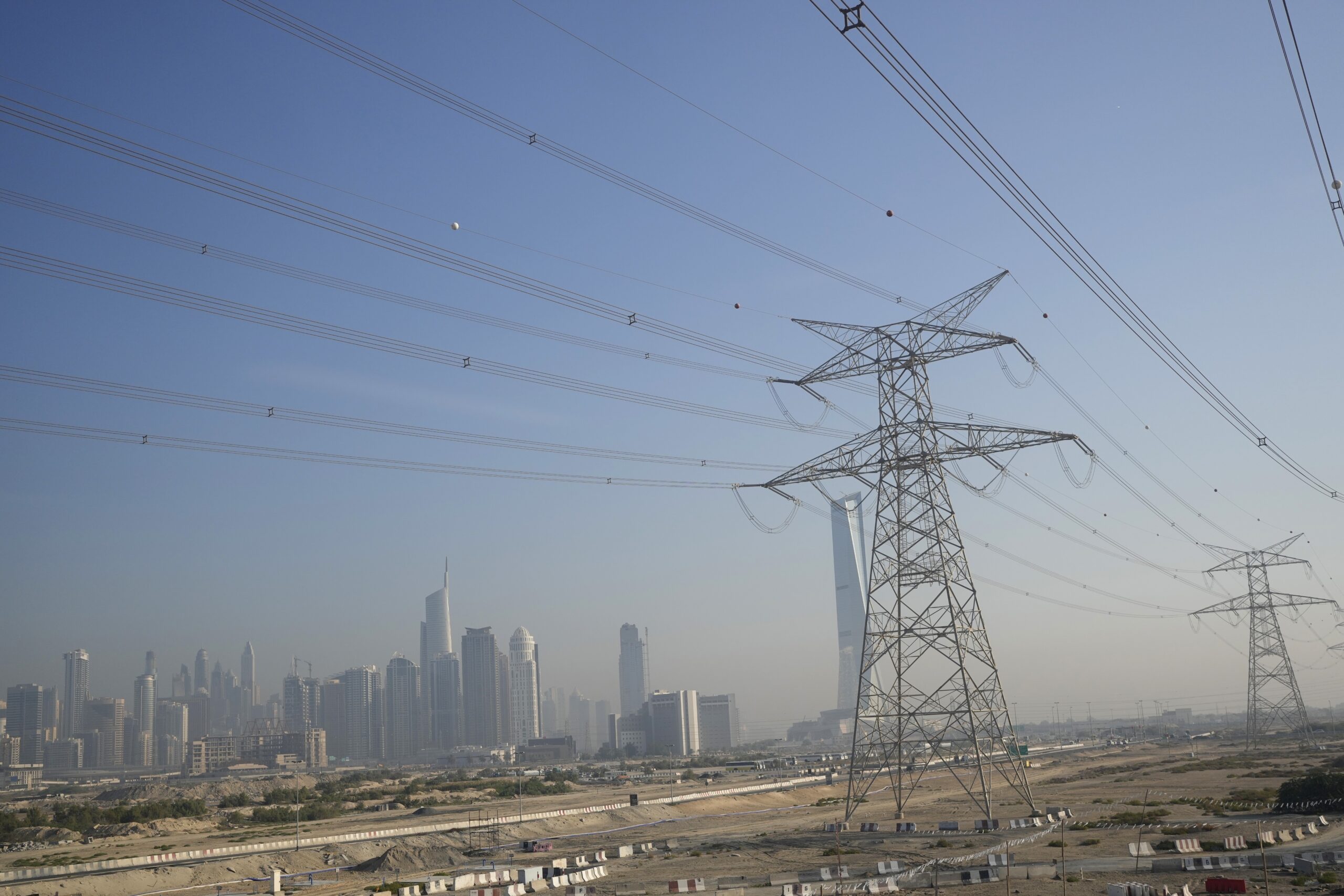 Transmission lines are visible in Dubai, United Arab Emirates, December 6, 2023. (AP Photo/Rafiq Maqbool)