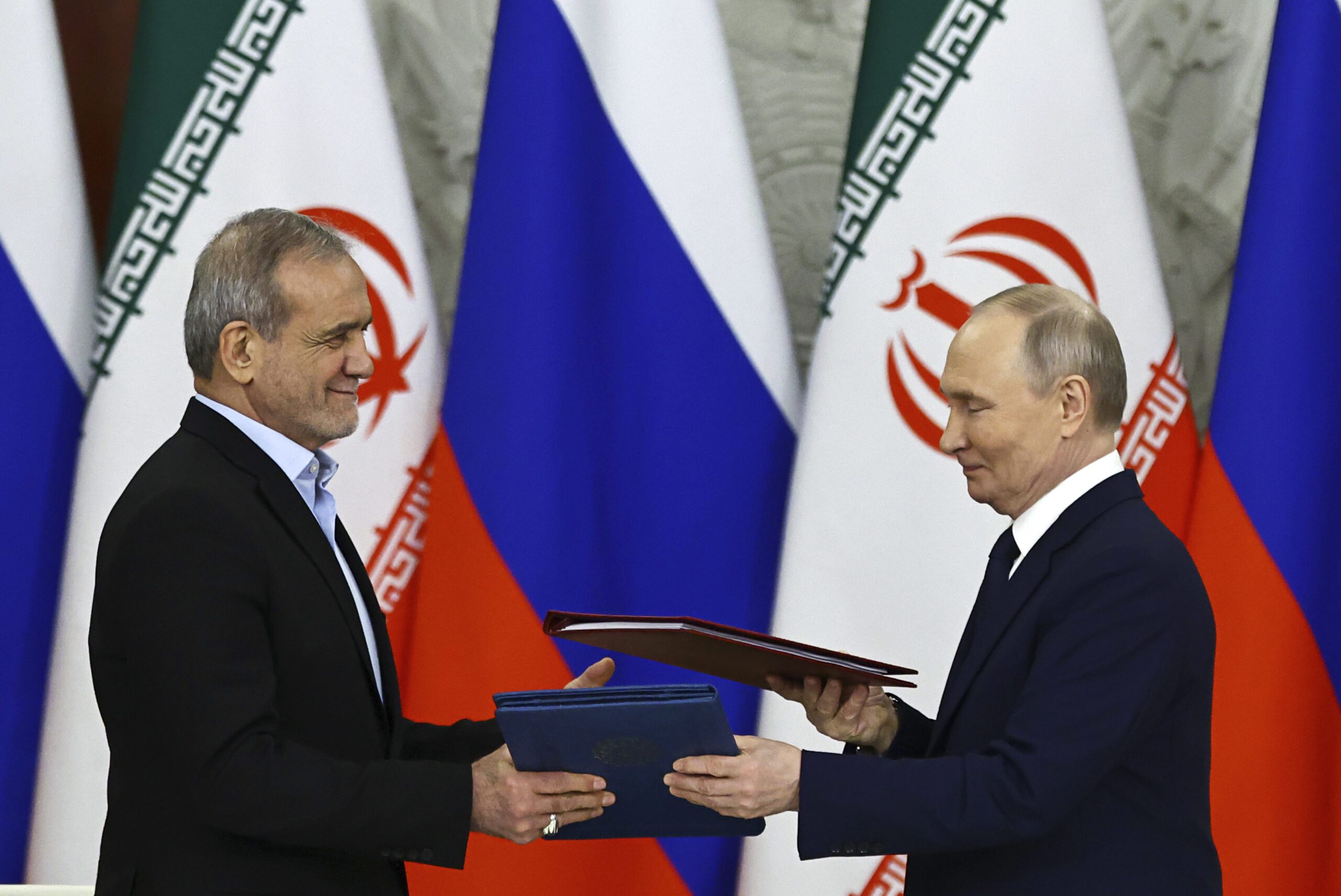 Russian President Vladimir Putin, right, and Iranian President Masoud Pezeshkian attend a signing ceremony at the Kremlin in Moscow, Russia, January 17. (Evgenia Novozhenina/Pool Photo via AP)