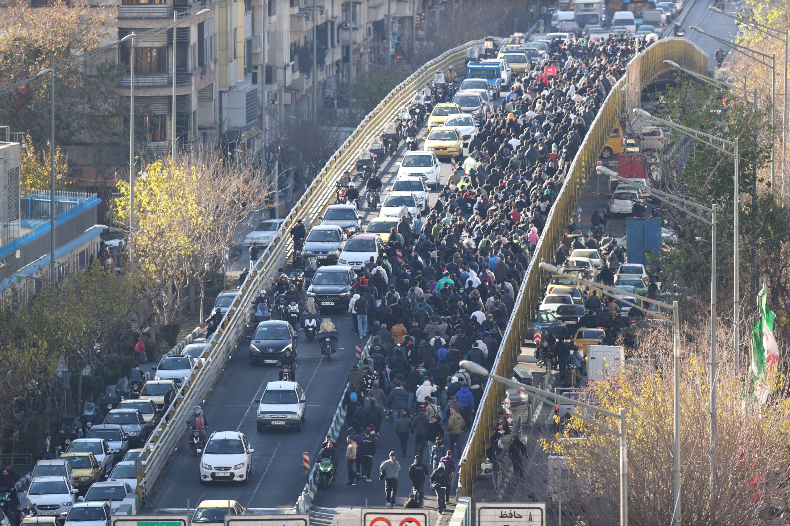 Protesters march on a bridge in Tehran, Iran, Dec. 29, 2025. (Fars News Agency via AP, File)