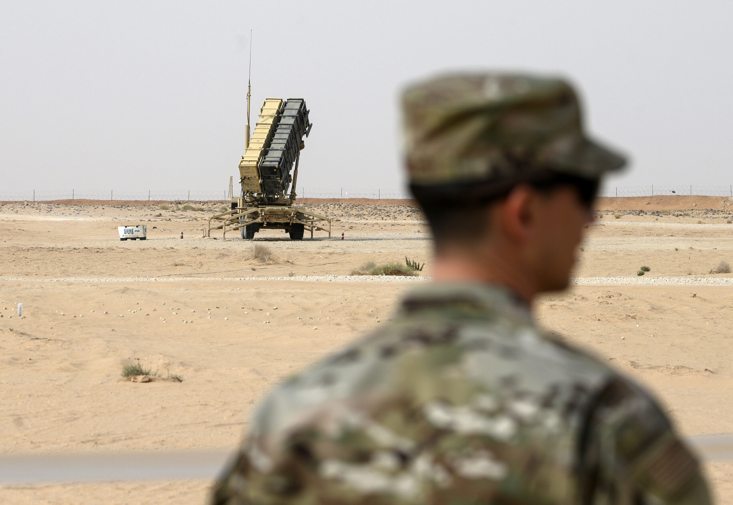 A member of the U.S. Air Force stands near a Patriot missile battery at the Prince Sultan air base in al-Kharj, Saudi Arabia, February 20. (Andrew Caballero-Reynolds/Pool via AP)