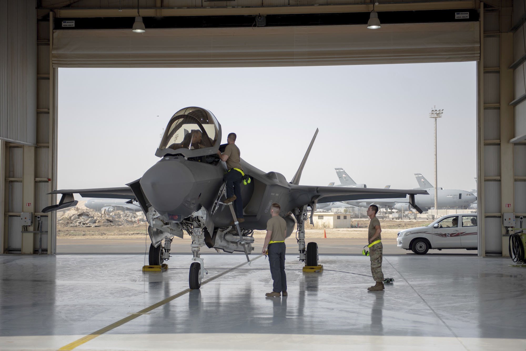 An F-35 fighter jet pilot and crew prepare for a mission at Al-Dhafra Air Base in the United Arab Emirates, Aug. 5, 2019. (Staff Sgt. Chris Thornbury/U.S. Air Force via AP)