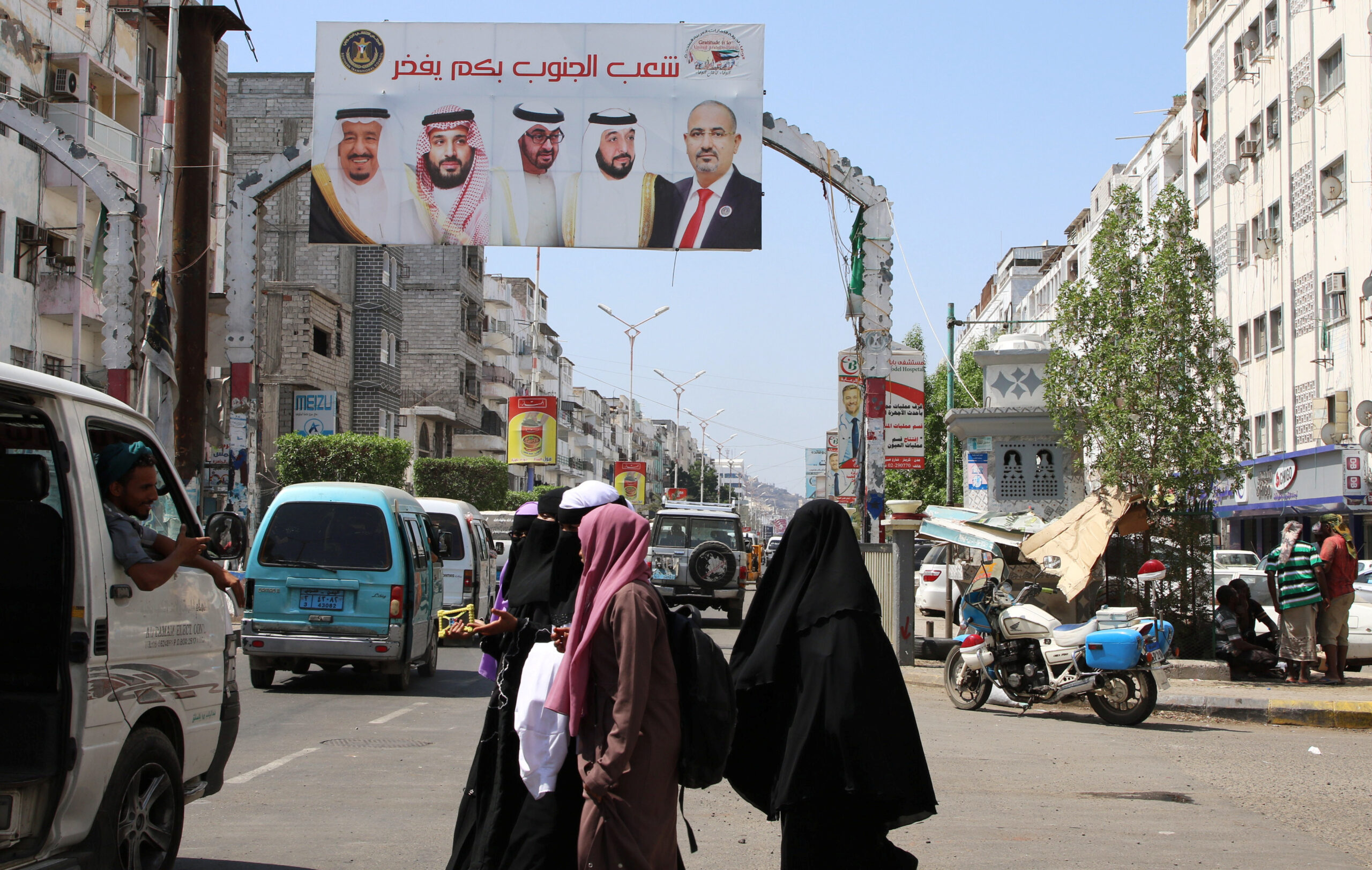 (From left) Cars drive under a billboard with posters of Saudi King Salman bin Abdulaziz, Saudi Crown Prince Mohammed bin Salman, Abu Dhabi Crown Prince Mohammed bin Zayed al-Nahyan, UAE President Khalifa bin Zayed al-Nahyan, and the head of Yemen's Southern Transitional Council Aidarous al-Zabidi, Aden, Yemen, November 5, 2019. (REUTERS/Fawaz Salman)